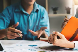 Advisor discussing plan of investment